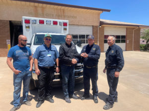 Commissioner Gil Almquist delivering a new County Ambulance to the Hildale Fire Department.