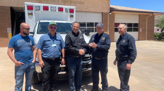 Commissioner Gil Almquist delivering a new County Ambulance to the Hildale Fire Department.