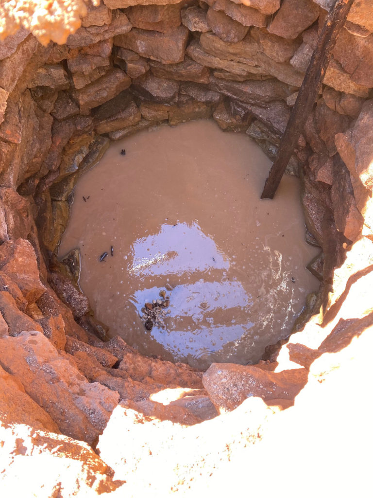 The well was carefully constructed and made of stacked, shaped sandstone blocks.
