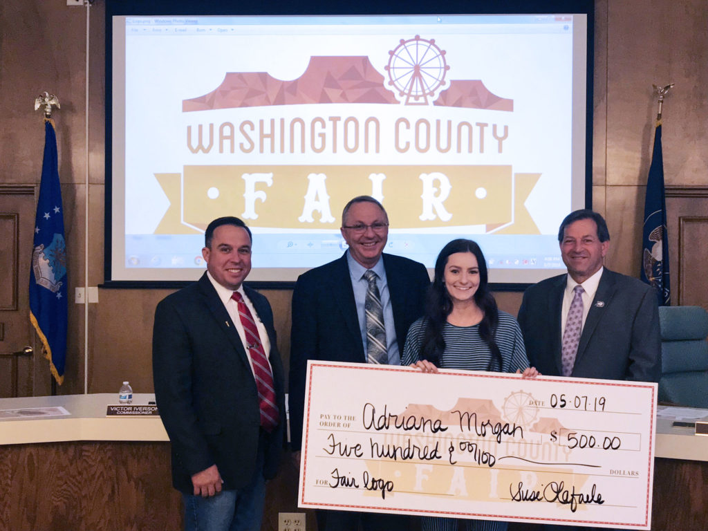 Commissioners presenting prize money to Adriana Morgan Fair Logo Contest 2019 Winner